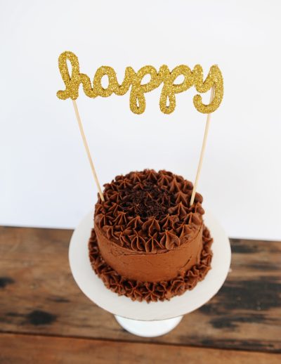Happy glittered cake topper